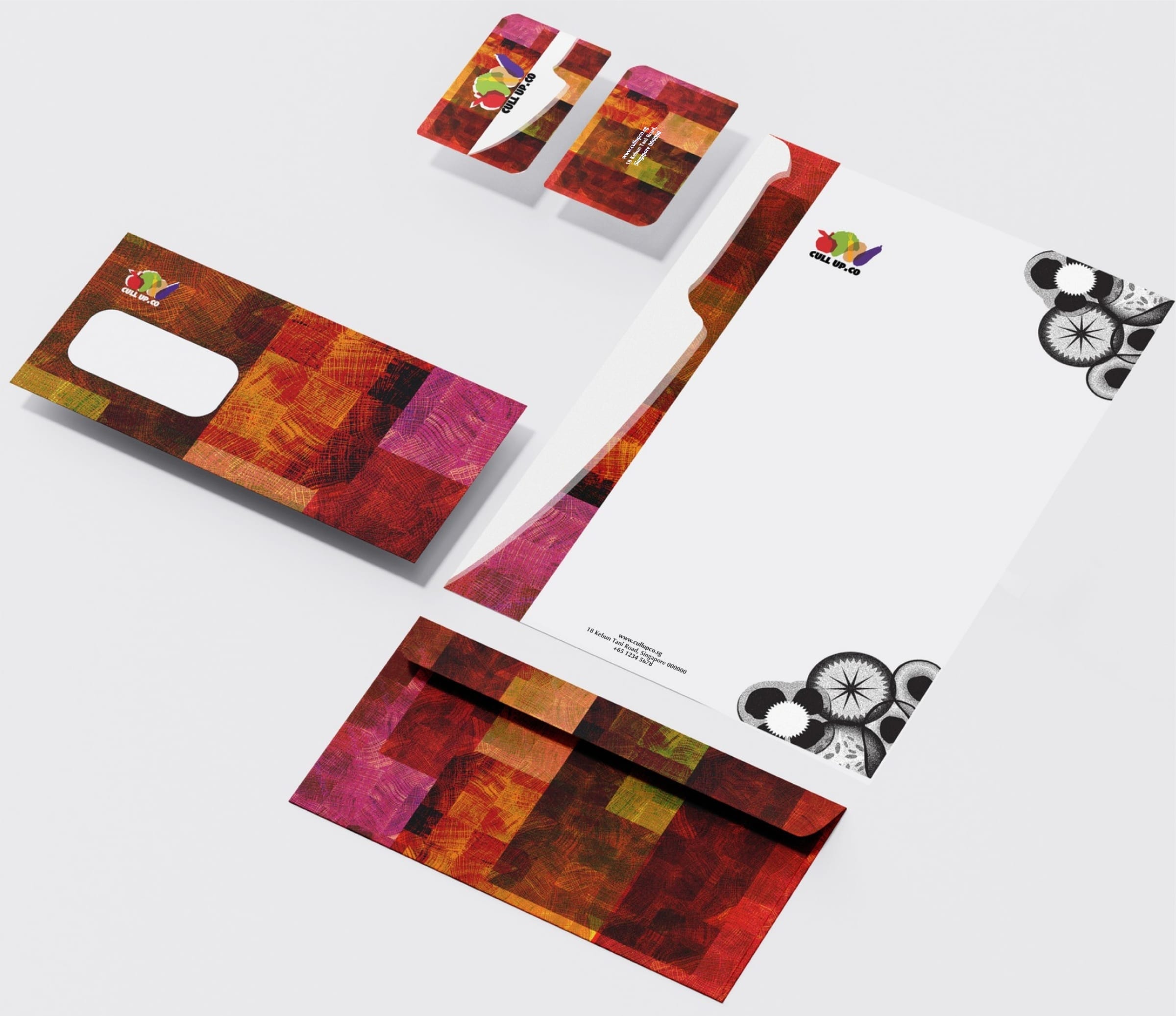 CULL UP.CO stationery: business cards, letterhead and envelopes in a warm red, orange and purple woodgrain mosaic